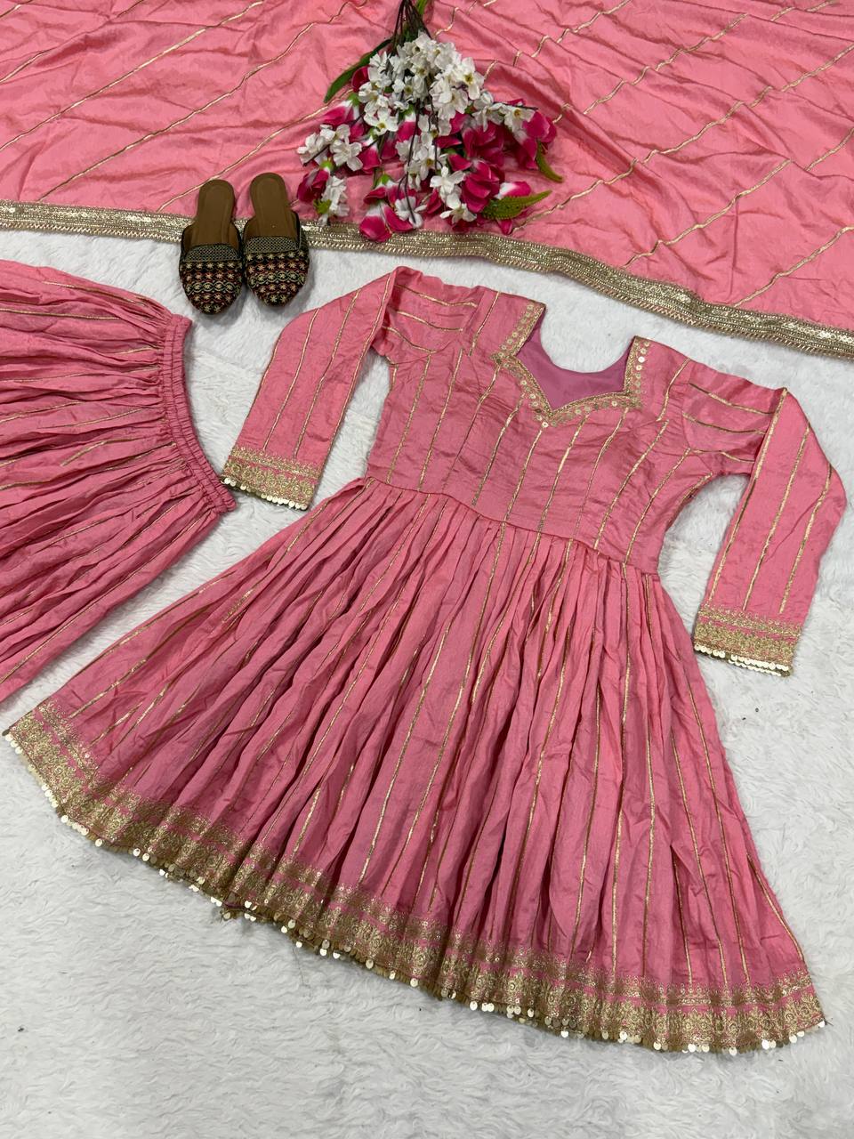 Radiant Rose Pink Flared Peplum Kurti and Sharara Set Embellished with Luminous Gold Zari Stripes and Sequined Borders